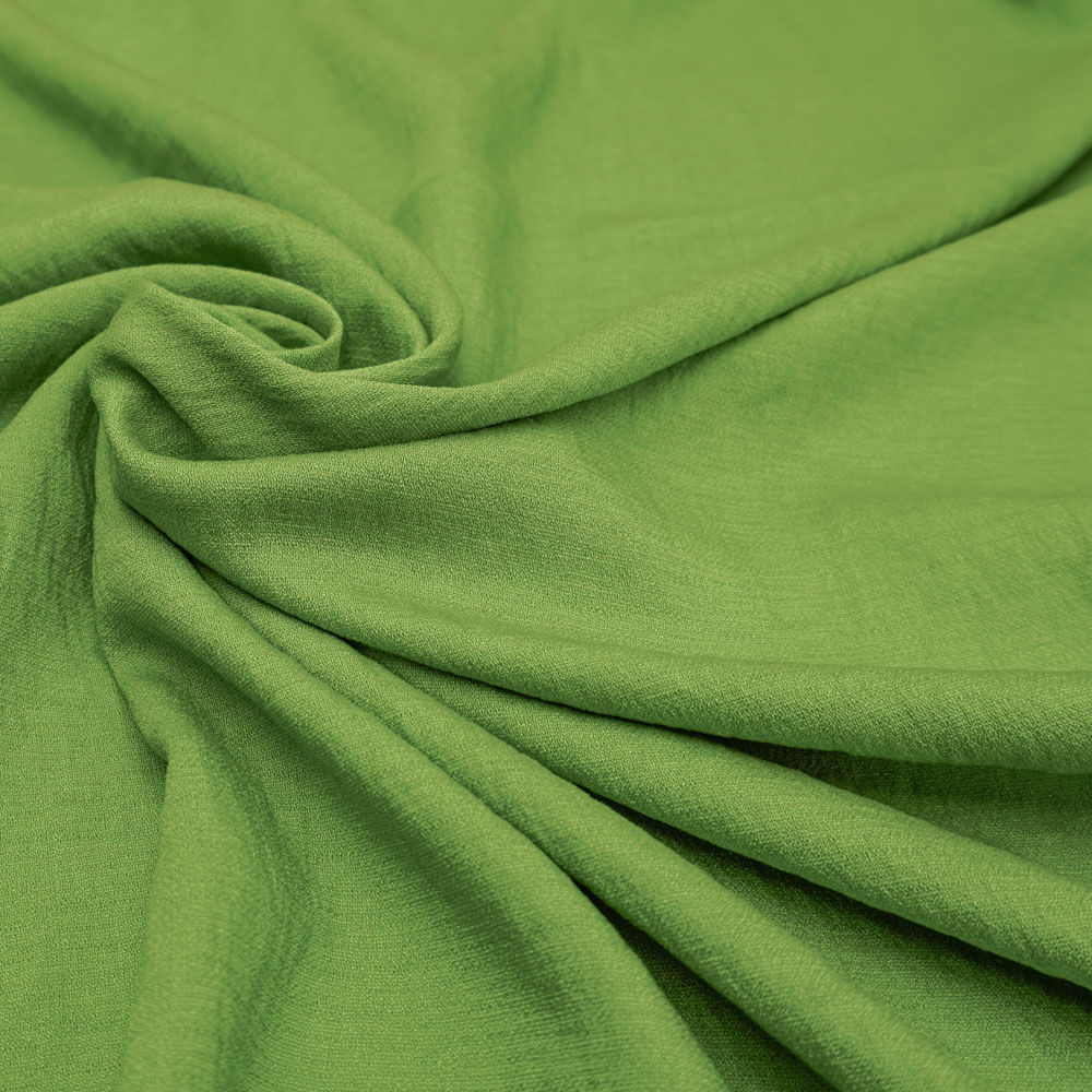 Tecido crepe leve com textura de linho verde folha