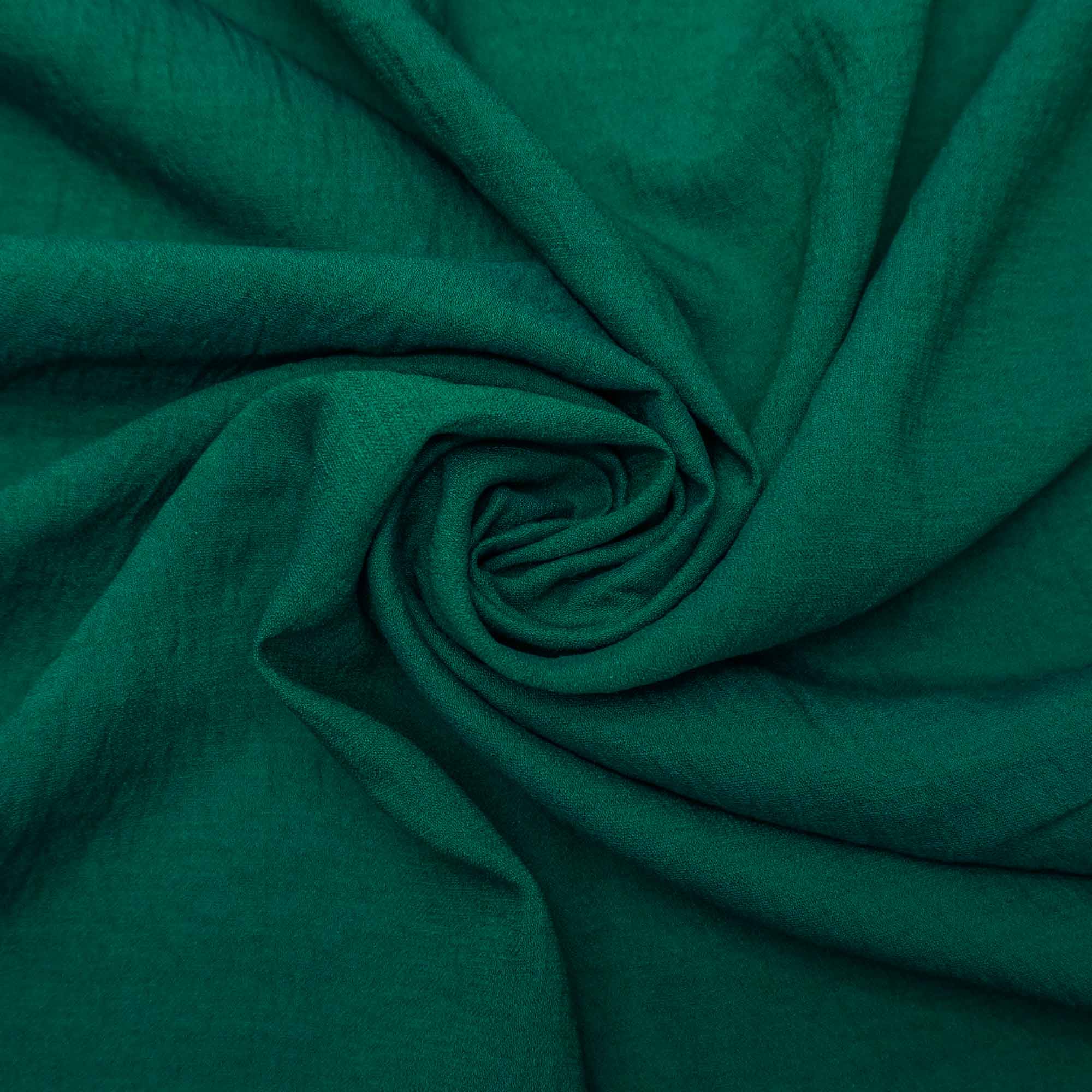 Tecido crepe leve com textura de linho verde esmeralda